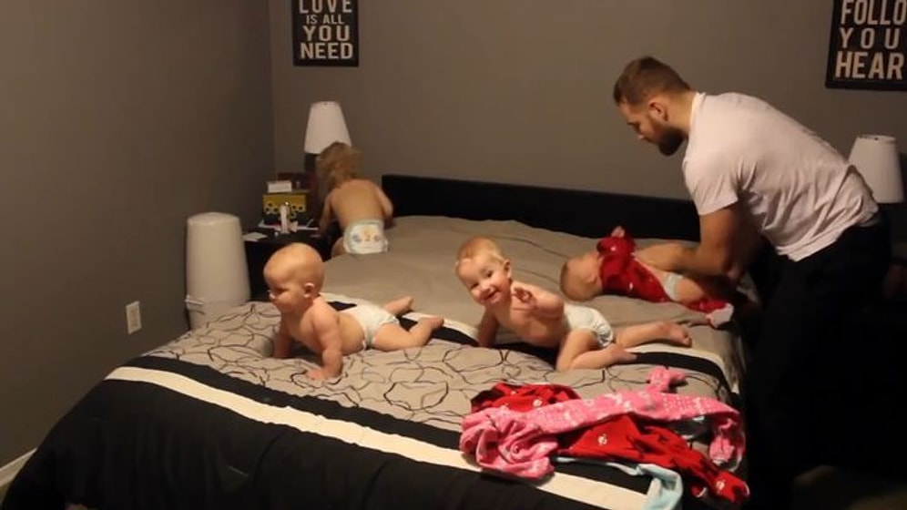 Миссия выполнима: молодой папа одновременно одел четырех малышей