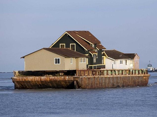 13. An existing home was removed by barge to make room for a separate activities building.