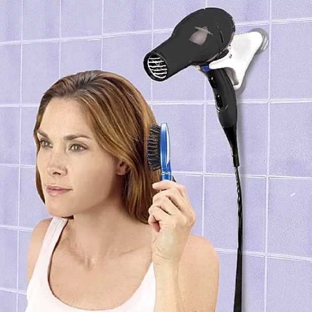 Tired of waiting for your hair to dry? Try a dryer holder. You'll thank us later.