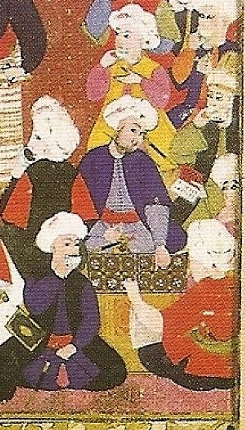 SaÄ alt kÃ¶Åede gÃ¶rÃ¼ldÃ¼ÄÃ¼ Ã¼zere iki kiÅi mangala oynamaktadÄ±r.