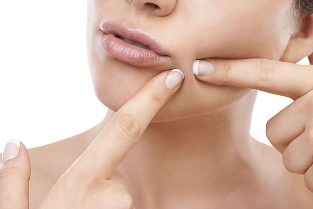 4. Popping your pimples.