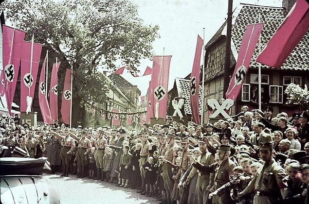 7. A scene along a roadway to the Fallersleben Volkswagen Works cornerstone ceremony, Germany, 1938.
