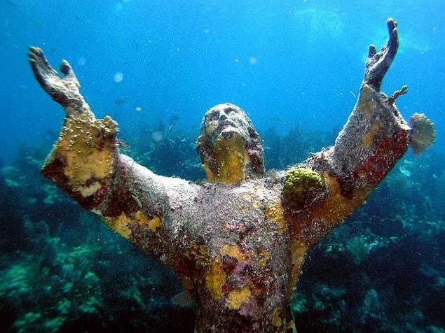 10. A Statue of Christ covered with corals at the bottom of the Atlantic near Key Largo island, USA