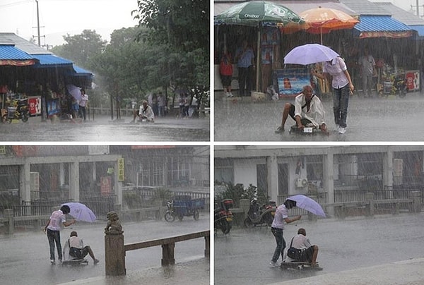 16. Женщина укрывает от дождя выпившего мужчину