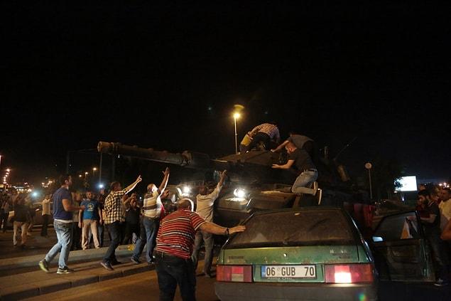 Unarmed civilians are trying to take over the tanks.