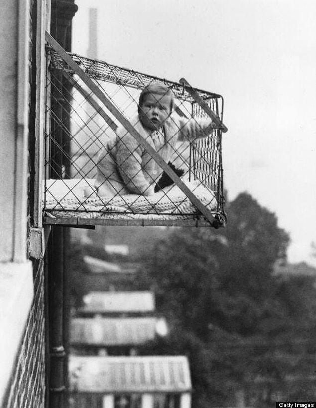 8. Cages were made for children to get fresh air in houses with no garden in London. (1930s)