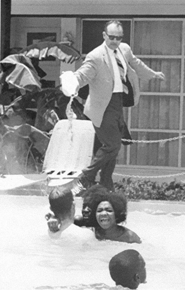 17. The hotel owner pouring acid into the pool while an African-American family was swimming in it. (1964)