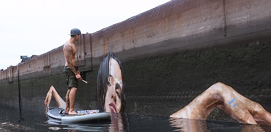 Стрит-арт от Шона Йоро - выплывающие из воды граффити