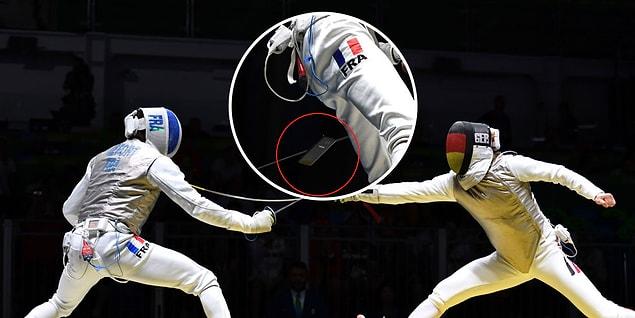 13. French fencing athlete Enzo Lefort dropped his cell phone from his pocket when he was competing with his German rival.