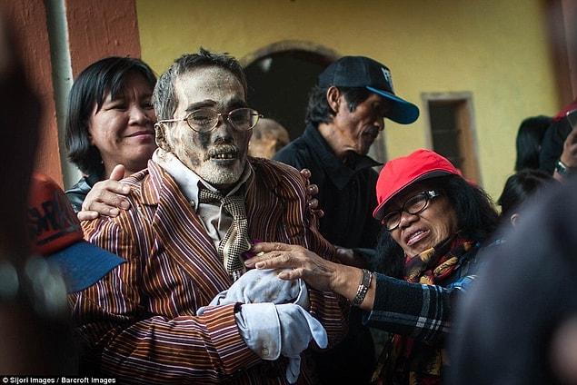The funeral is never the last time their relative's body is seen. Whenever an elderly villager dies, their body is wrapped in several layers of cloth to prevent decay.