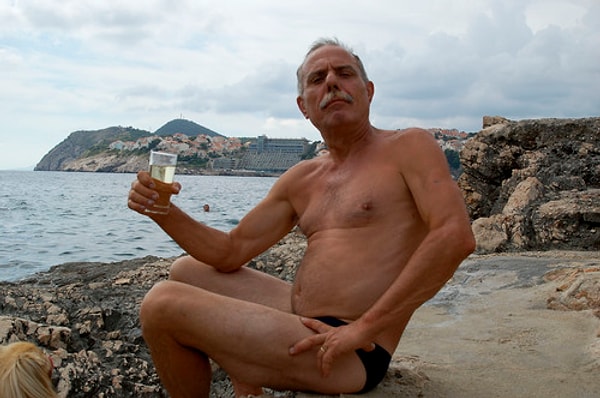 2. Old European guy with a very small bathing suit.