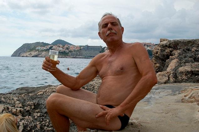 2. Old European guy with a very small bathing suit.