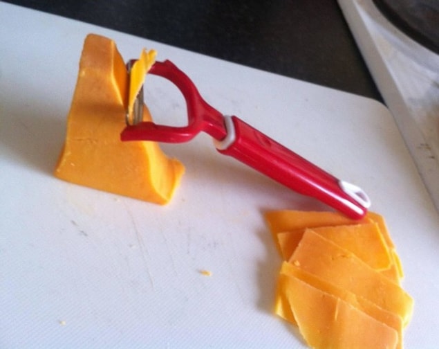 18. If you have a hard time cutting thin slices of cheese, you can use the potato peeler!