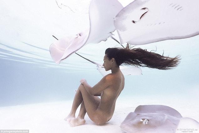 Rava Ray can trust only 3 photographers to capture her naked diving and magic touch with marine animals.