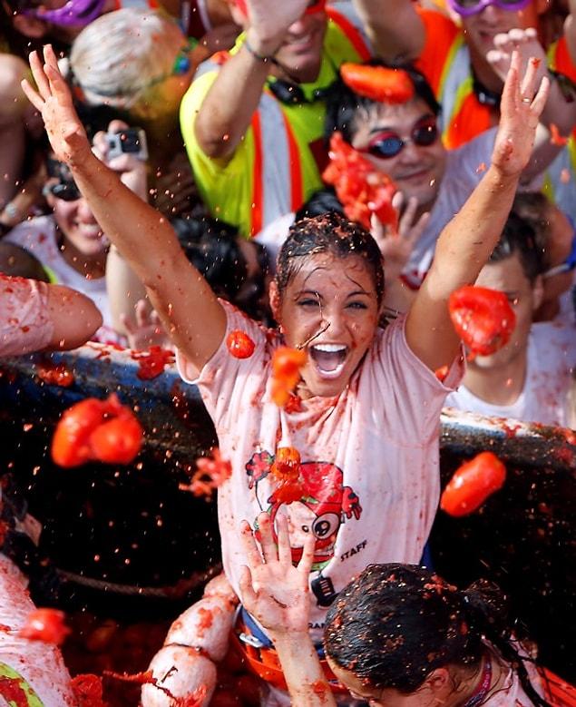 The participants were all red and covered in tomatoes. With the help of the local people washing them with hoses, they were able to clean themselves.
