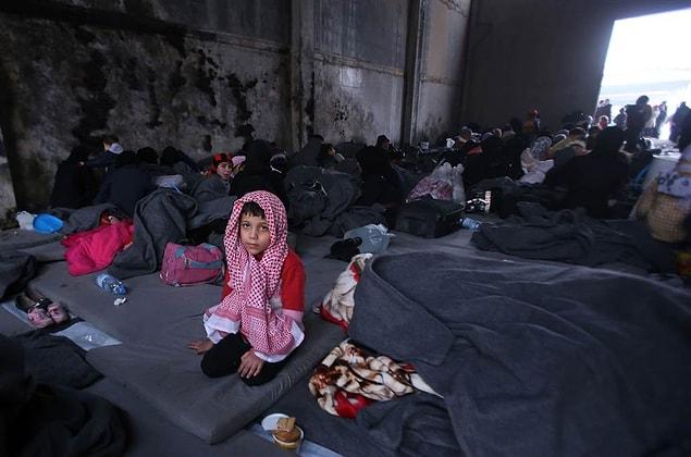 9. A Syrian boy, who fled with his family from rebel-held areas in the city of Aleppo, sits on Nov. 30, at a shelter in the government-controlled area of Jibreen.