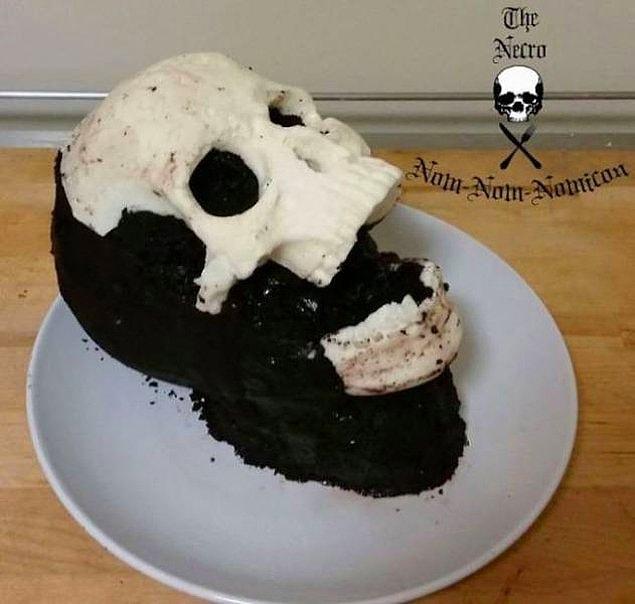 Once the cake is cool, she attaches the chocolate skull using chocolate buttercream frosting.