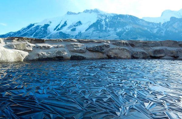 16. A frozen pond in Switzerland.