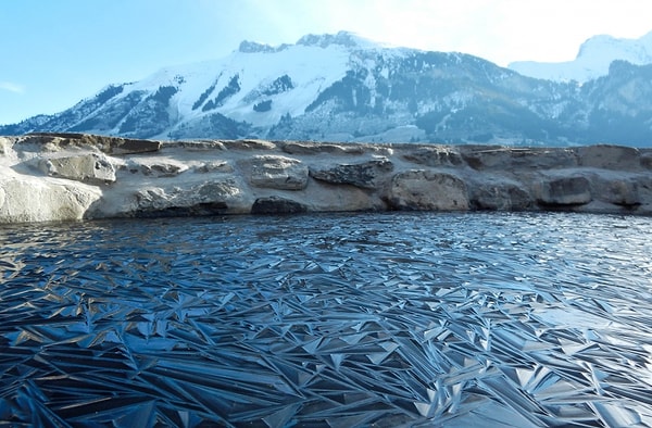 16. A frozen pond in Switzerland.