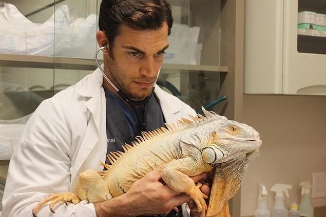 And here he is looking all hot and serious with a really big and exotic iguana. 😆