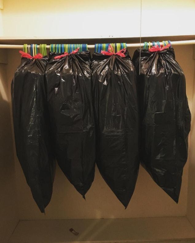 2. Cover your clothes with trash bags when you’re packing or moving if you don’t want to take them off the hanger.