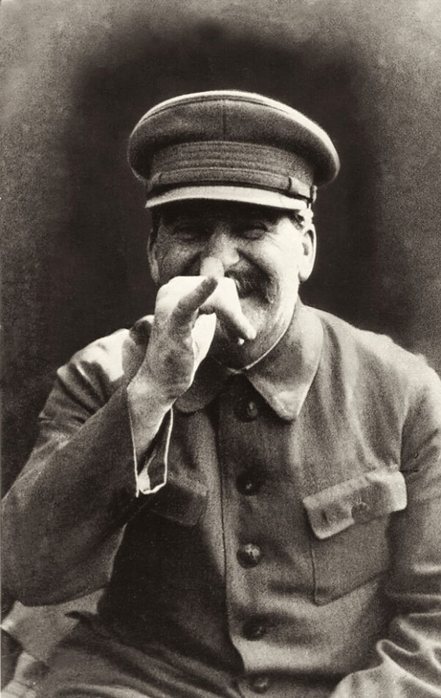 16. Stalin pulling a face at his bodyguard