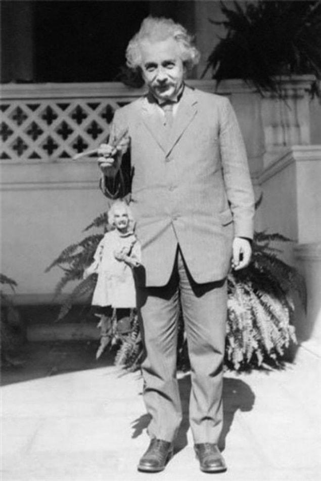 18. Einstein holding an Einstein puppet