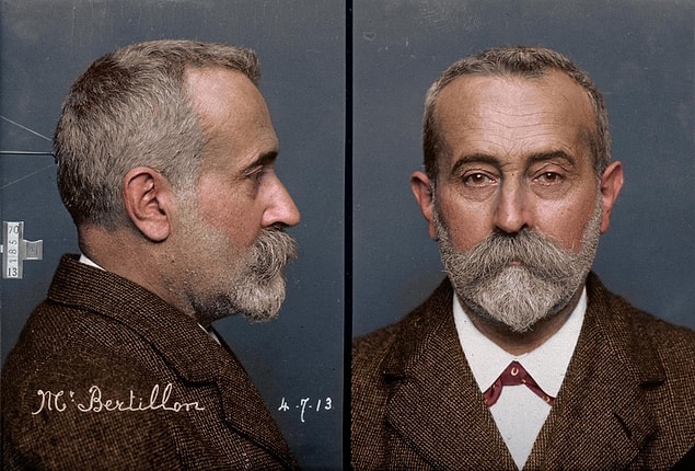 4. Alphonse Bertillon, in 1913, demonstrating the two-part 'mug shot' method of photographing suspects that he pioneered.
