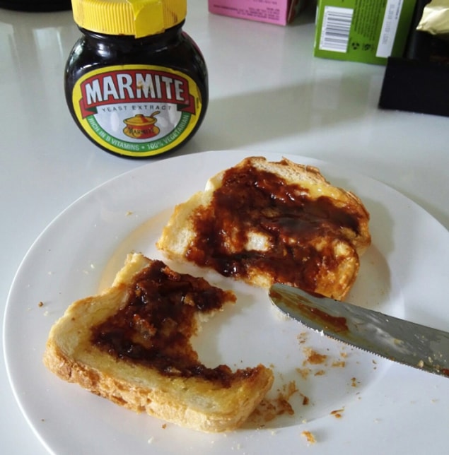 2. Spreading Marmite over buttered toast.