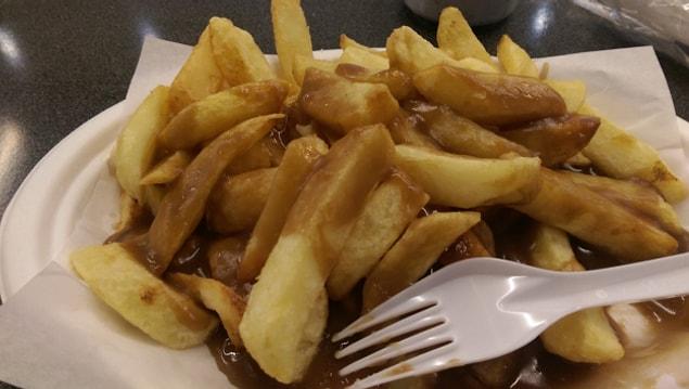 10. Covering chips with gravy.