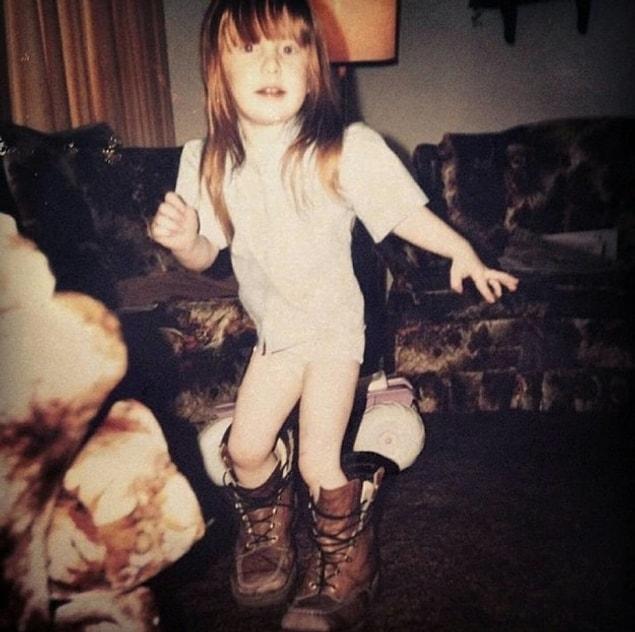 15. “Age 3, stomping around in my dad’s boots because #fashion.”
