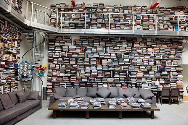 5. As you can see it from the photographs, Lagerfeld's house has a high-ceiling. Legendary designer uses a ladder to reach out the books over the top shelves.