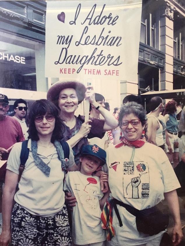 It turns out that this woman, Frances Goldin, has been attending NYC Pride for over 30 years with that sign. Her daughters, Reeni and Sally Goldin (pictured below) currently reside in New Paltz, New York, and San Francisco, California.