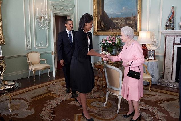 12. Michelle and Barack Obama approaching Queen Elizabeth II