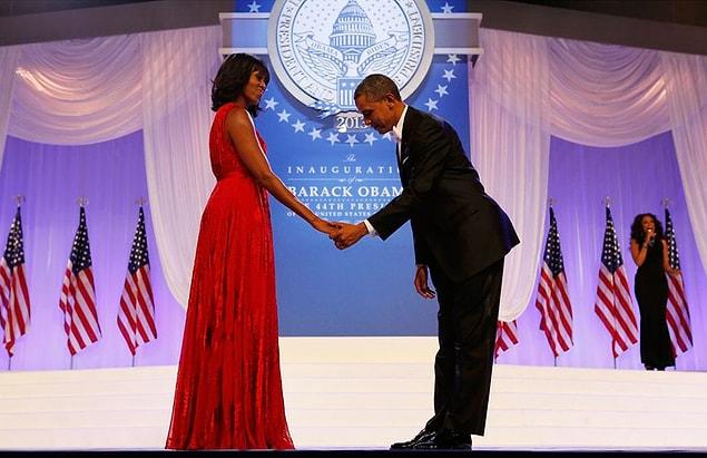 16. Barack Obama bowing in front of his wife. January 21, 2013
