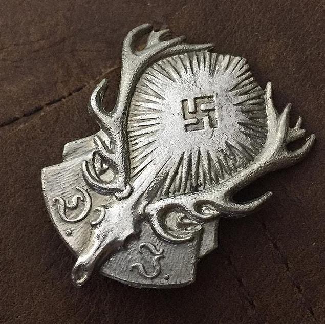 12. A German Youth Hunting Association Badge (D.J) in silvered tombac.