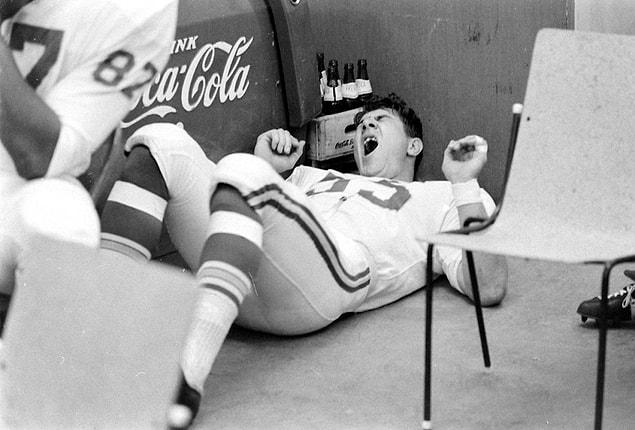 5. J Holub, linebacker for the Kansas City Chiefs, lies on the floor and yawns before the start of the game.
