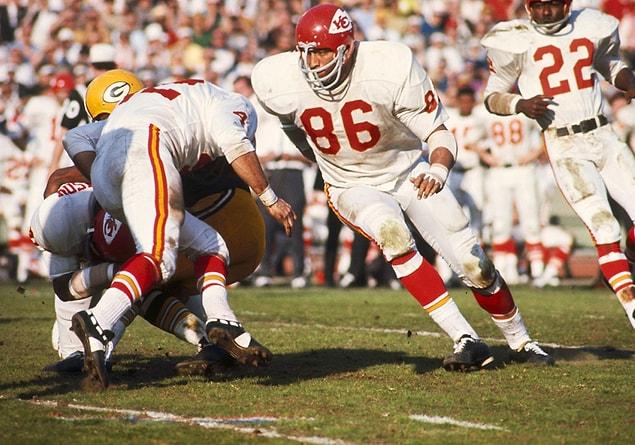 10. Kansas City Chiefs Hall of Fame defensive tackle Buck Buchanan (86) charges upfield during the game.