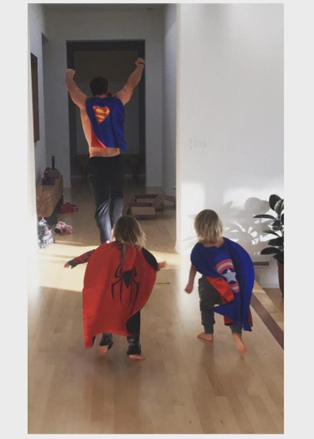 3. Chris Hemsworth playing superheroes with his twin sons.
