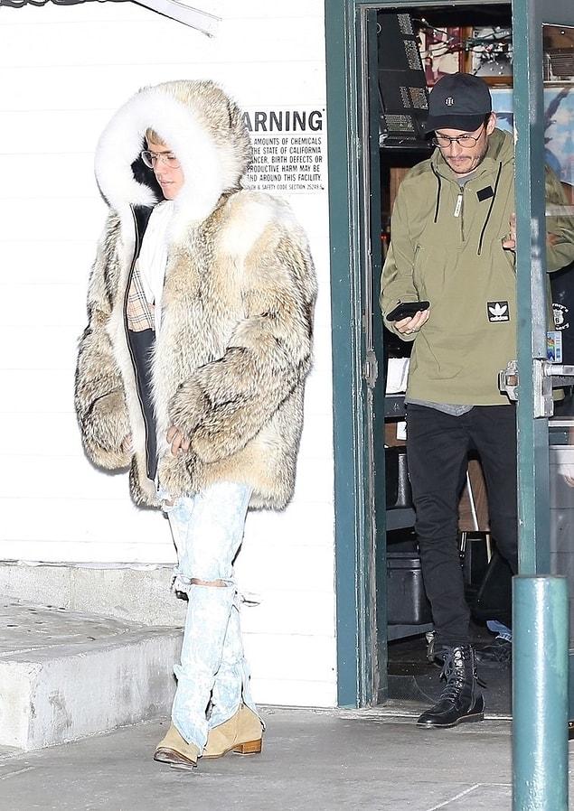 1. Giant fur, ripped jeans, and heeled boot.