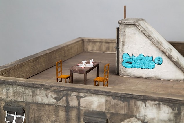 Using finely carved cardboard.