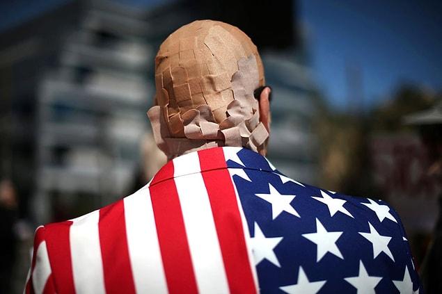 1. A man protests President Trump’s proposed replacement for Obamacare by covering his head in Band-Aids in Los Angeles on March 14.