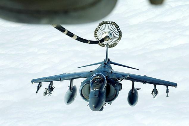 10. A US Marines Harrier AV-8B supporting Operation Inherent Resolve is suspended from a US Air Force KC-10 Extender during a midair refueling over Iraqi and Syrian airspace on March 15.
