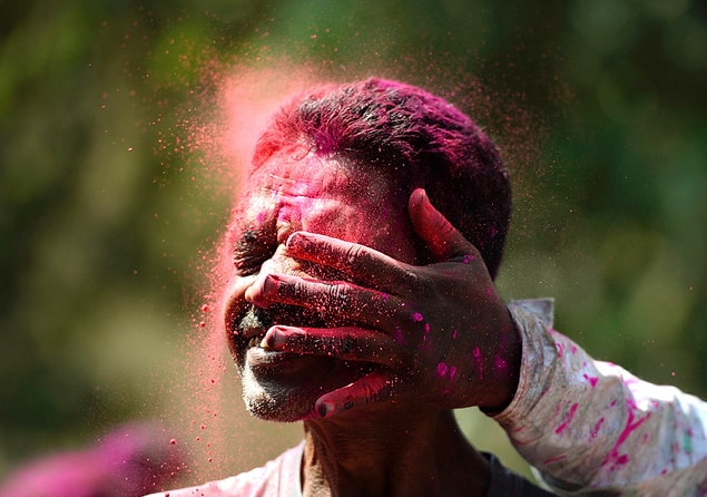 20. An Indian man is smeared with colored powder during the Holi celebrations in Mumbai on March 13. Holi, or the festival of colors, is a riotous celebration of spring observed the day after the full moon each March.