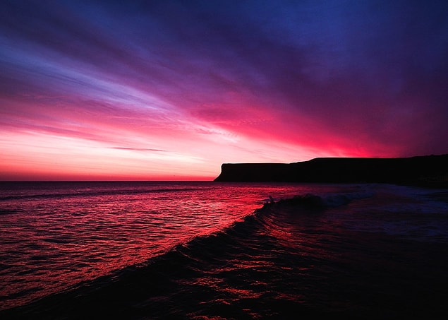 21. The morning sky is awash in red as the sun rises behind Huntcliff in Saltburn-by-the-Sea, England, on March 15.