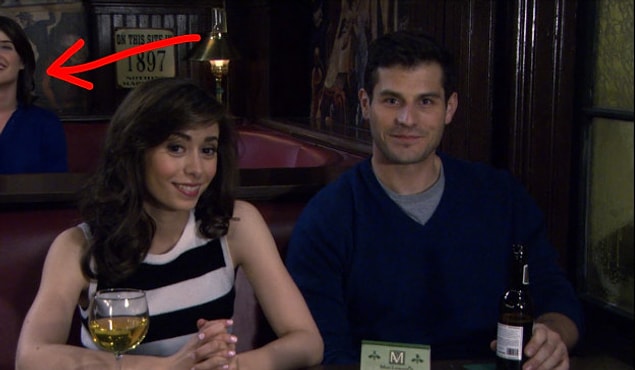 19. Robin can be spotted in the back of Tracy and Louis's photo.