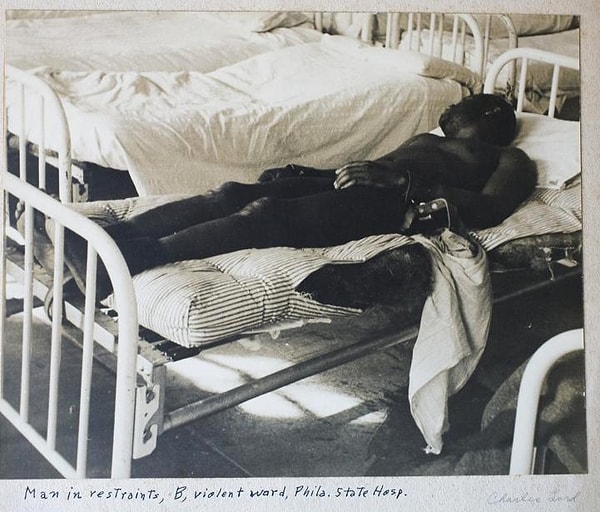 12. Philadelphia State Hospital at Byberry. A man in restraints, B, violent ward. 1945.