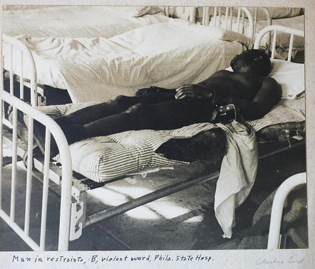 12. Philadelphia State Hospital at Byberry. A man in restraints, B, violent ward. 1945.