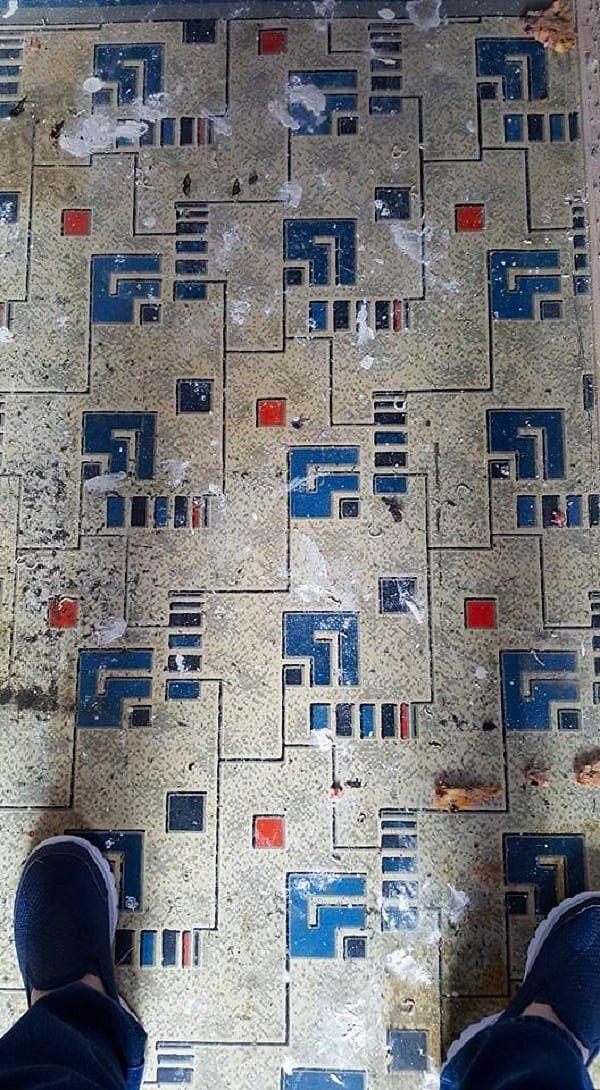 3. "Cousin was pulling up carpet in very old home and found this 'interesting' linoleum design."