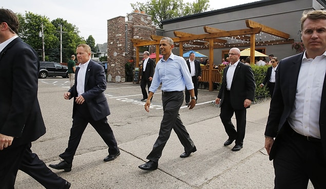 The secret service politely placed themselves in the kitchen and asked multiple questions about the meal and the staff's night while the food was being prepared.